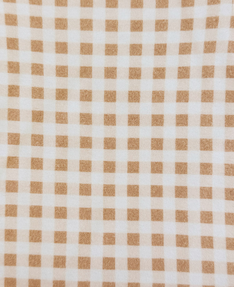 Detalhe do tecido do Body Manga Curta Vichy Bege MiniMalista: xadrez vichy bege em malha de algodão macia. Body de bebê unissex, estamparia atóxica.