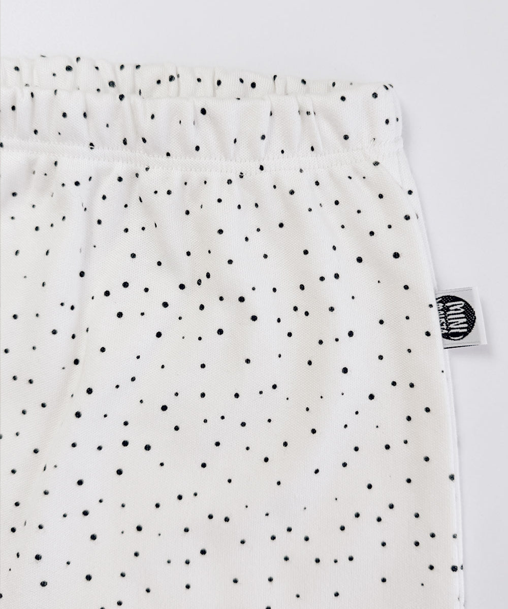 Detalhe do tecido e da estampa de bolinhas da Calça Harém Bolinhas Claro MiniMalista. Calça de bebê em algodão premium, unissex, estampa atóxica.