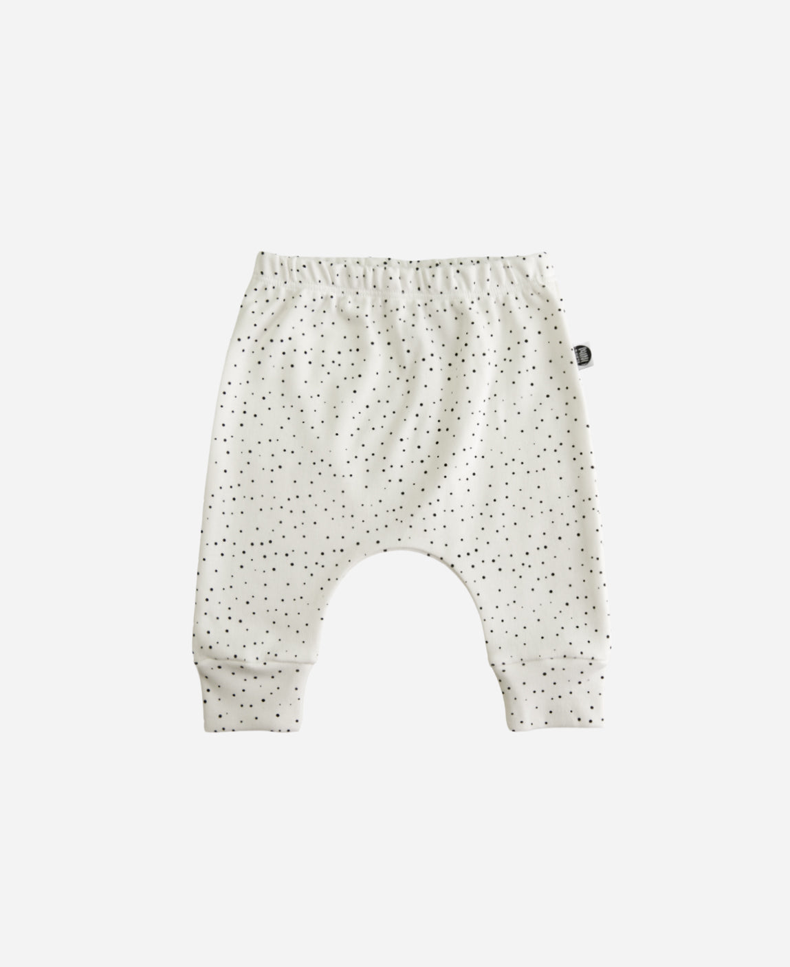 MiniMalista Calça Harém Unissex em Bolinhas Claro, vista frontal. Bolinhas delicadas sobre Branco Off, 100% algodão fio egípcio, modelagem harém. Calça de bebê para menino e menina.