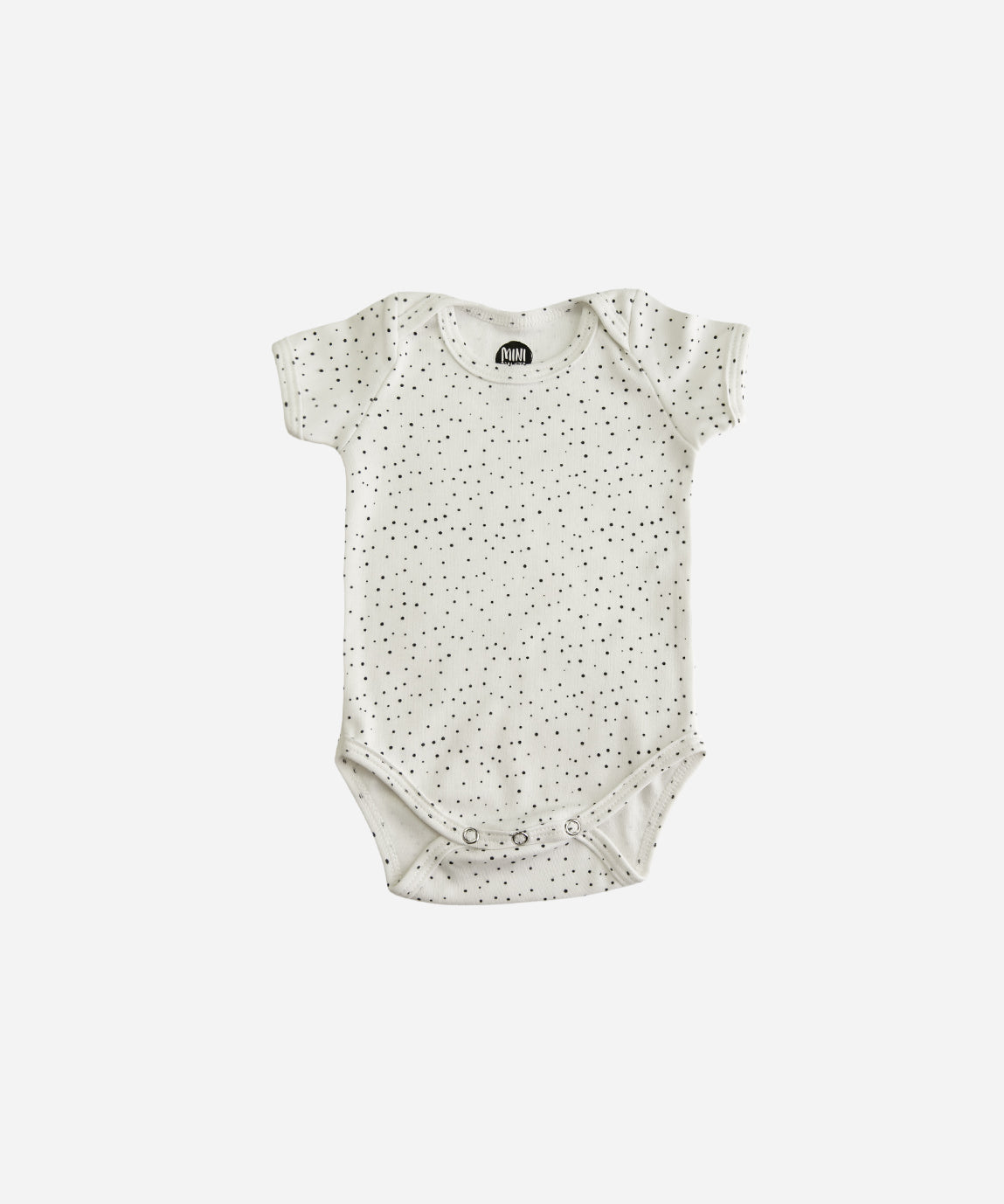 MiniMalista Body de Bebê Manga Curta Unissex em Bolinhas Claro, vista frontal. Bolinhas delicadas sobre Branco Off, 100% algodão fio egípcio, gola americana e 3 botões entrepernas. Body de bebê unissex para menino e menina.